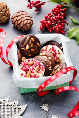 Luxury handmade chocolate mediants, cookies, bites in a gift box. Traditional french Christmas dessert.