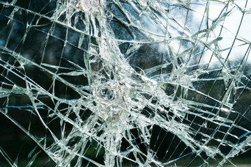 Criminal incident at the bus stop. Shooting a pistol. Hole and cracks in the glass of a city bus...