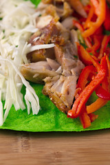 Ingredients for cooking shawarma lie on a pita bread. Middle Eastern dish to grill.