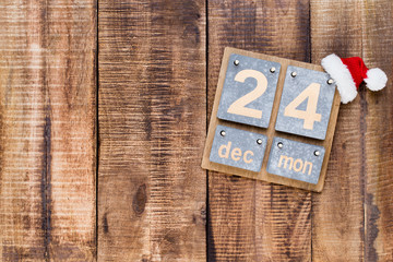 Christmas greeting card wooden background.