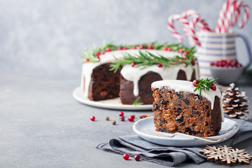 Christmas fruit cake, pudding on white plate. Traditional New Year dessert. Copy space.