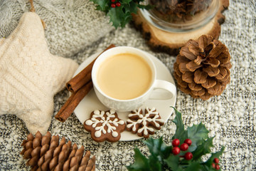 Obraz na płótnie Canvas Morning coffee in a cup. Christmas composition. Cup of coffee, anise star, christmas cookies. top view.