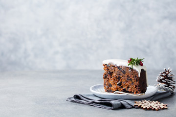 Christmas fruit cake, pudding on white plate. Copy space.