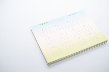 Obraz premium Blurred green calendar on white tone.