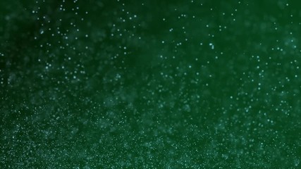 Abstract green motion background animation with small bubbles rising. Backdrop motion with copyspace.
