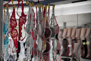 Lace bras for sale at the market, Bologna, Italy. These fabrics include, nylon, polyester, satin, lace, transparent fabrics, lycra and silk.