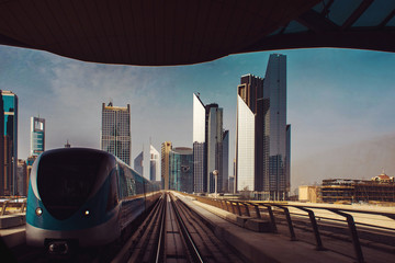 streets of a large modern city. Skyscrapers and above ground subway Of Dubai