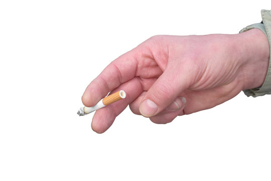 Hand holding a smoking cigarette with a yellow filter close-up isolated