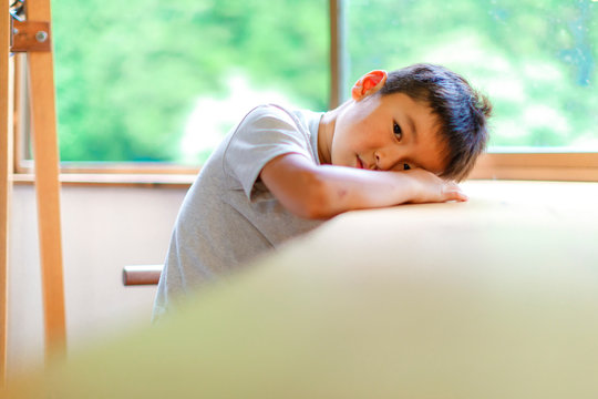 A boy who is bored