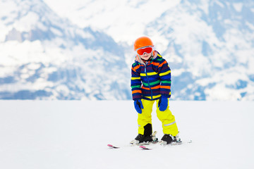 Kids ski. Winter family snow sport. Child skiing