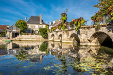 View on old bridge in a small historic French town in Loire Valley. - obrazy, fototapety, plakaty