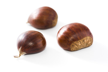 Raw chestnuts isolated on white background
