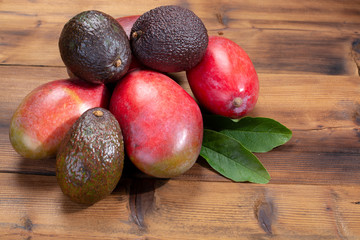 New harvest of healthy fruits and vegetables, tropical organic ripe red mango and hass avocado ready to eat © barmalini