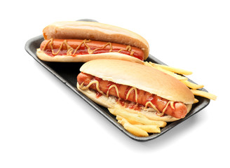 Tasty hot dogs with french fries on white background