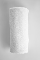 Clean rolled towel on light background