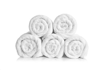 Clean rolled towels on white background