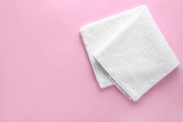 Clean soft towel on color background