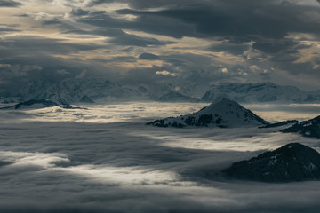 Mountain peaks of Austrian Alps above clouds