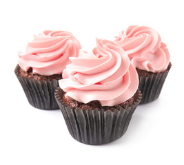 Delicious cupcakes on white background