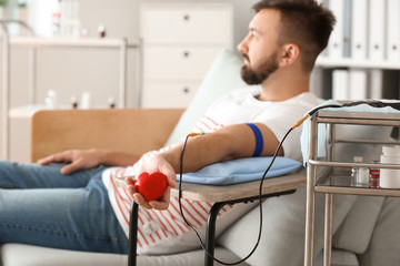 Man donating blood in hospital