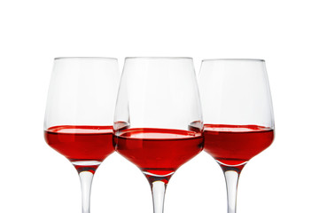 Glasses with sweet tasty wine on white background
