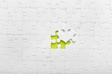 White jigsaw puzzle with piece