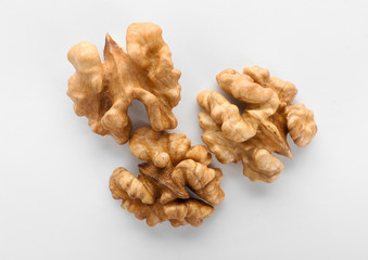 Shelled walnuts on white background