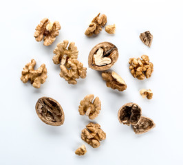 Tasty walnuts on white background