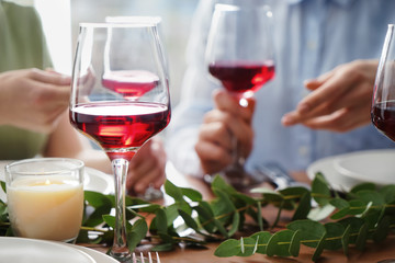 Glass of red wine on table set for party