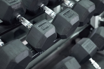 heavy dumbbells on the stand in gym