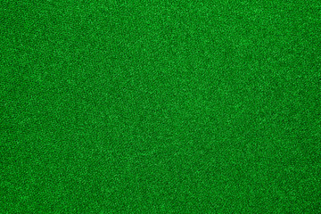 The texture of the carpet is green.Background of green carpet.