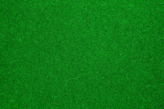 The texture of the carpet is green.Background of green carpet.