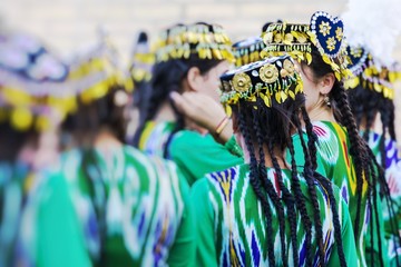 Folk dancers performs traditional dance at local festivals in Khiva, Uzbeksitan. - obrazy, fototapety, plakaty