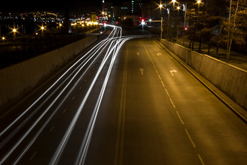 Fototapeta na wymiar strips from headlights, blurred from cars at night
