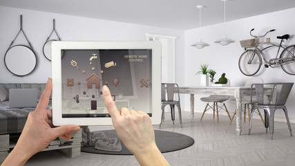 Smart remote home control system on a digital tablet. Device with app icons. Scandinavian modern...