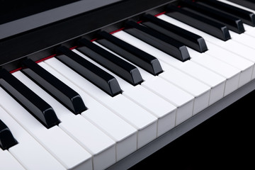 Naklejka premium Grand piano keyboard with glossy black and white keys as a music, Select focus and soft focus.