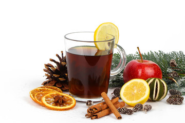christmas background - christmas tea or mulled wine - cup of red tea and orange - isolated on white...