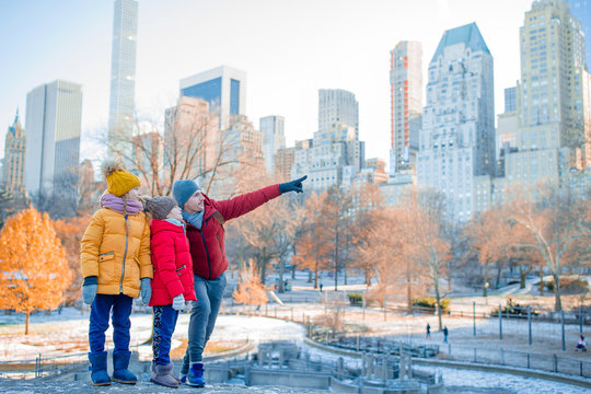 Family Of Father And Kids In Central Park During Their Vacation In New York City