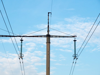 Winter landscape on the background of high-voltage electrical wires in the forest