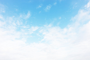 Blue sky background and white clouds soft focus, and copy space