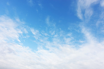 Blue sky background and white clouds soft focus, and copy space