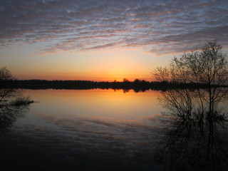 Naklejka na ściany i meble sunset over the lake