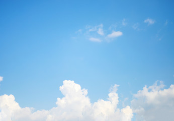 Blue sky background and white clouds soft focus, and copy space