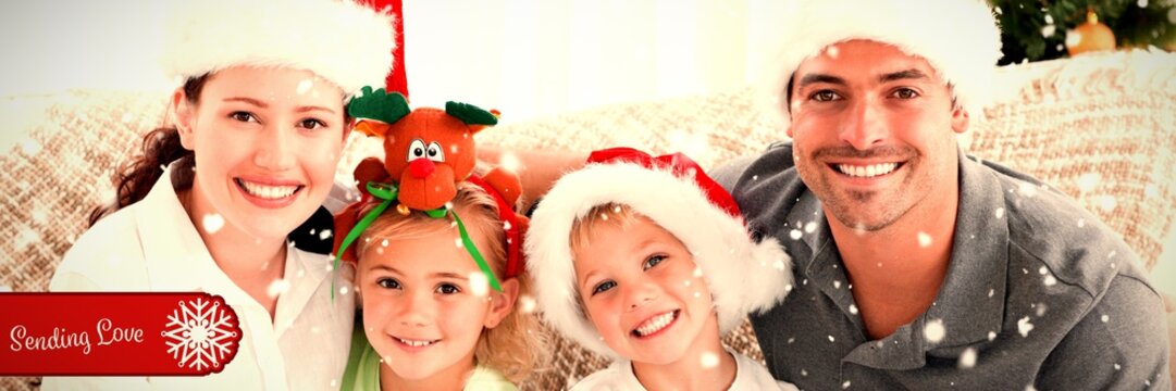 Composite image of portrait of a happy family with christmas