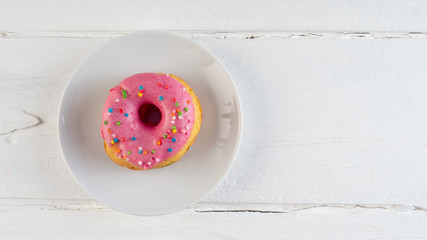 Donut on white background. Close up. Copy space.