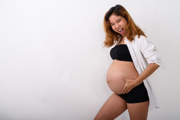 Fototapeta premium Portrait of beautiful young pregnant Asian woman