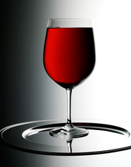 SINGLE GLASS OF RED WINE WITH BUBBLES