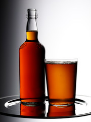 GLASS OF ALE AND BOTTLE