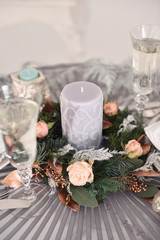 Christmas decor for table setting, or wedding decor, studio with a Christmas tree. Christmas decorations toys, candles, fir branches