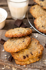 Oatmeal cookies with chocolate served with milk